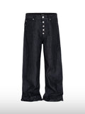 Jeans larghi con patta e bottoni
