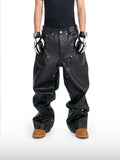 Jeans in pelle borchiati
